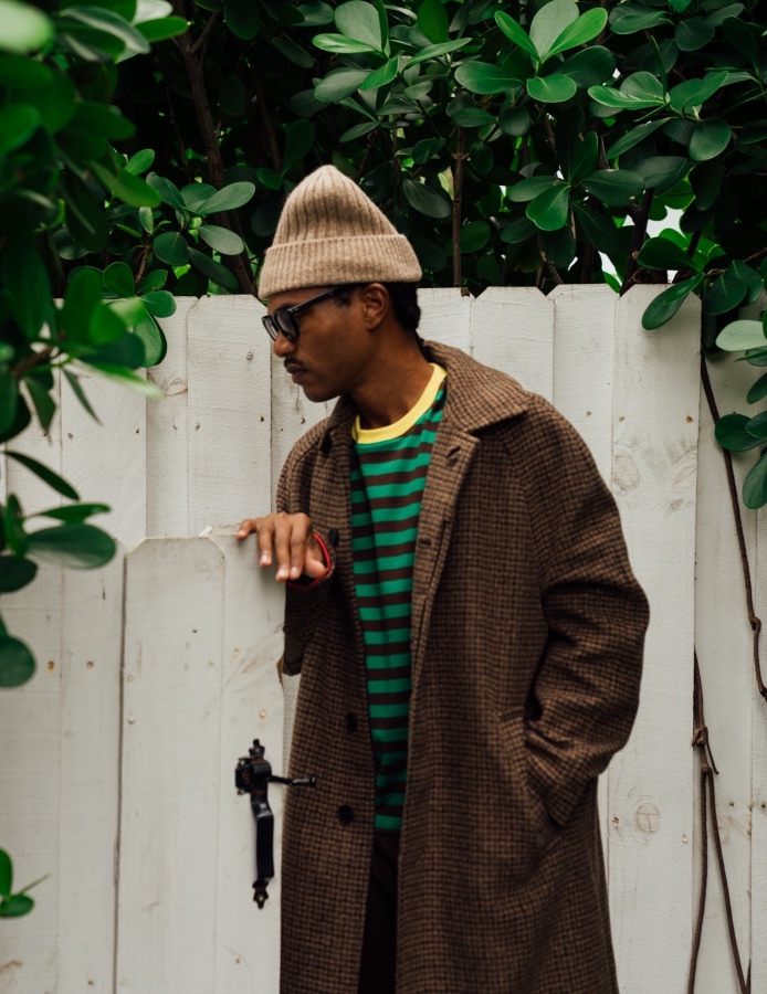 Outerwear and beanie, styled outdoors